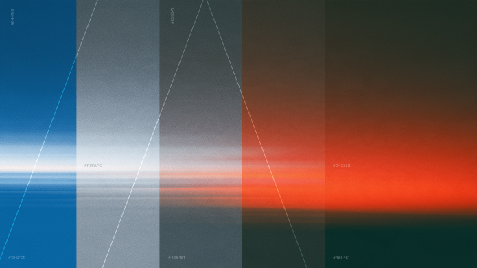A sunset split into blue, grey, charcoal and red vertical bands, with a large letter A outlined across them